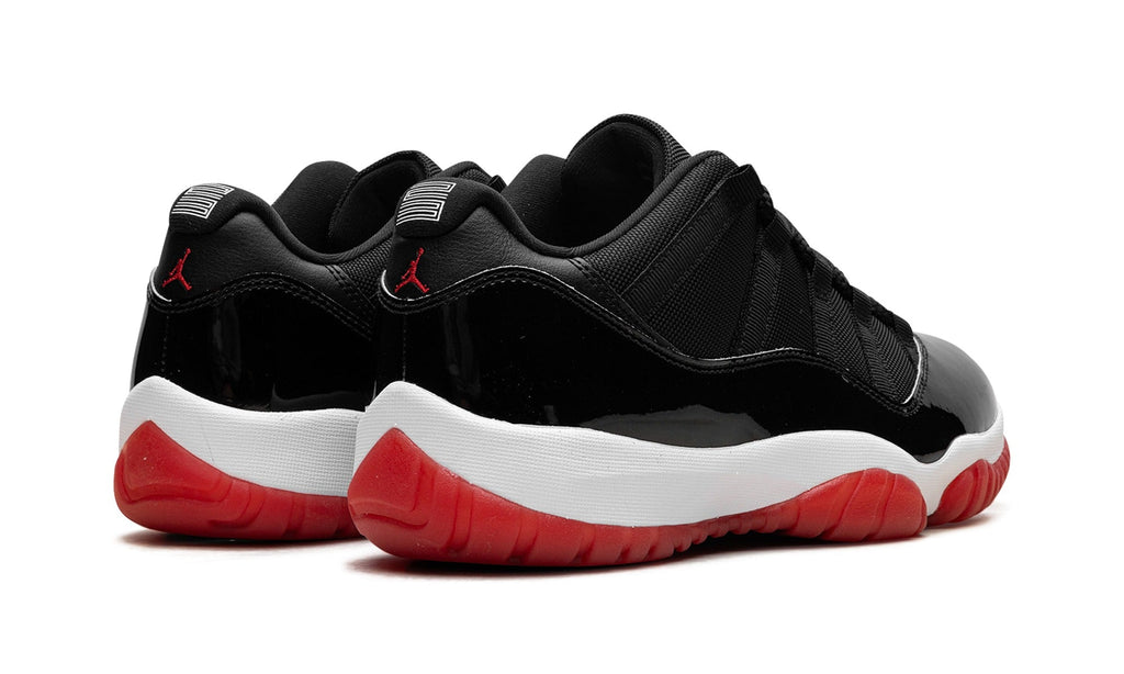 Air Jordan 11 Low Sneakers – Black, Red & White