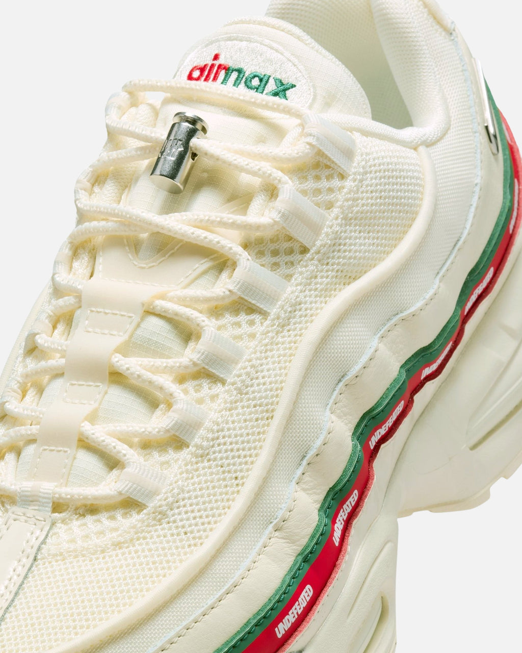 UNDEFEATED x Nike Air Max 95 Sneakers – Cream with Red & Green Accents